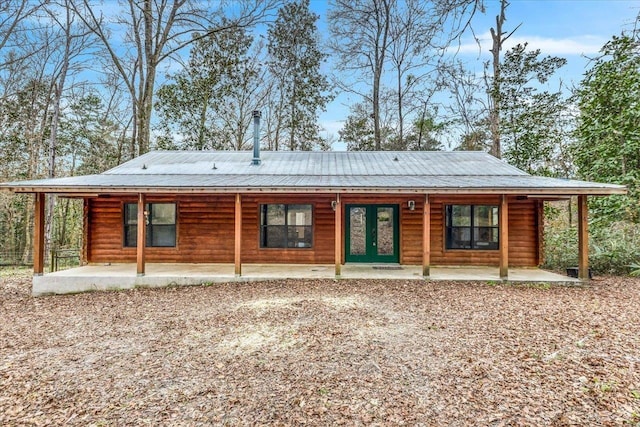 rear view of house with french doors and a patio area