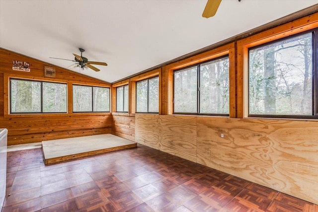 unfurnished sunroom featuring ceiling fan and lofted ceiling