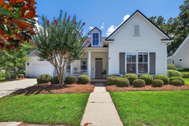 3256 Whitman Way, Tallahassee, FL 32311 - view of front of property featuring a porch, a front lawn, a garage, and driveway