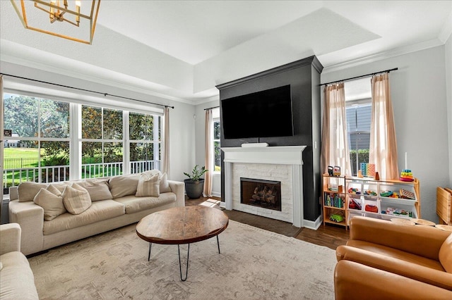 3256 Whitman Way, Tallahassee, FL 32311 - living area with ornamental molding, wood finished floors, and a fireplace