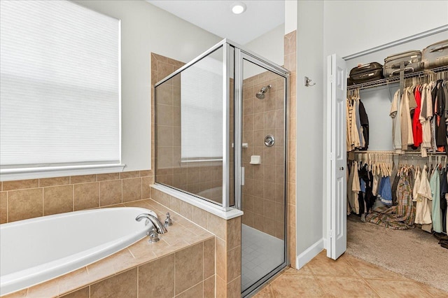 3256 Whitman Way, Tallahassee, FL 32311 - bathroom with a garden tub, a stall shower, a spacious closet, and tile patterned floors