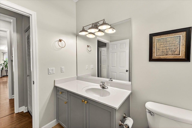 3256 Whitman Way, Tallahassee, FL 32311 - half bathroom with vanity and wood finished floors