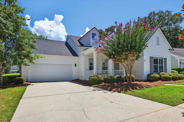3256 Whitman Way, Tallahassee, FL 32311 - view of front of property featuring covered porch, a garage, concrete driveway, a front lawn, and a shingled roof