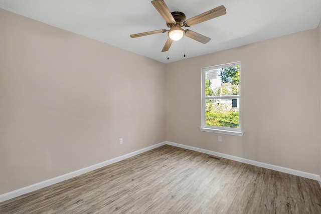1618 Mayhew St, Tallahassee, FL 32304 - unfurnished room featuring baseboards, a ceiling fan, and wood finished floors