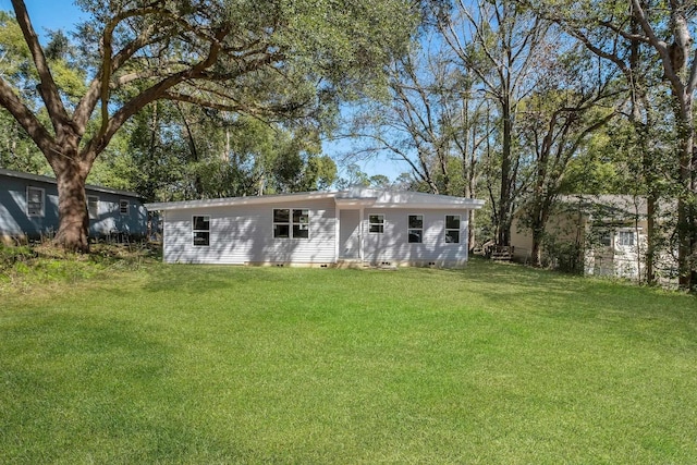 1618 Mayhew St, Tallahassee, FL 32304 - rear view of house featuring a lawn and crawl space