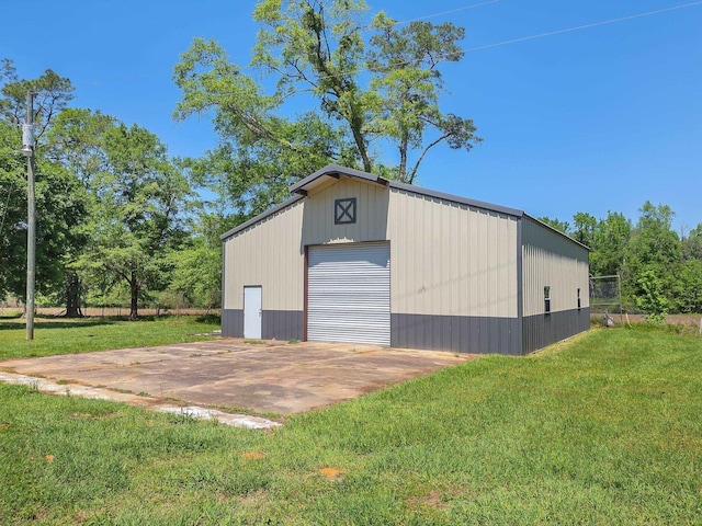 detached garage featuring driveway