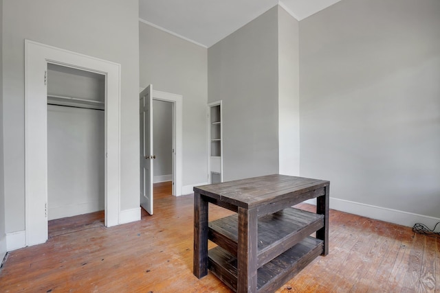 dining space featuring light wood finished floors and baseboards