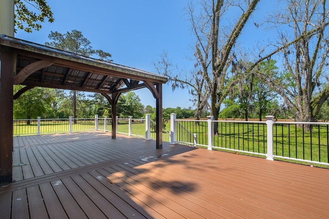 deck with a yard and a gazebo