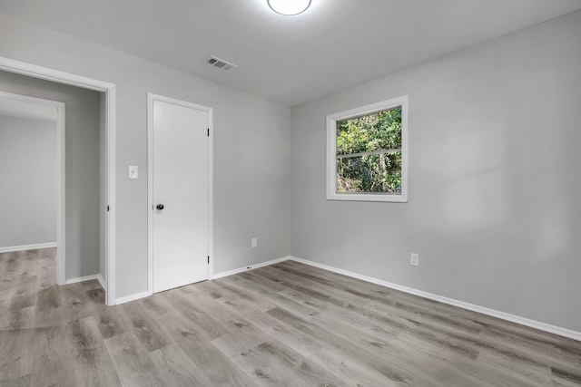 2204 Berkshire Dr, Tallahassee, FL 32304 - unfurnished room featuring wood finished floors and baseboards