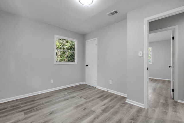 2204 Berkshire Dr, Tallahassee, FL 32304 - unfurnished room with plenty of natural light, wood finished floors, and baseboards
