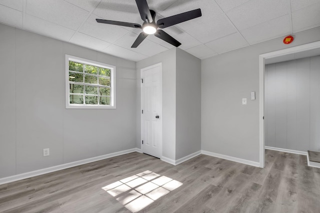 2204 Berkshire Dr, Tallahassee, FL 32304 - unfurnished bedroom featuring wood finished floors, a paneled ceiling, baseboards, and a ceiling fan