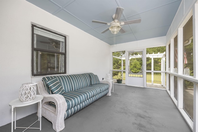 sunroom / solarium featuring ceiling fan