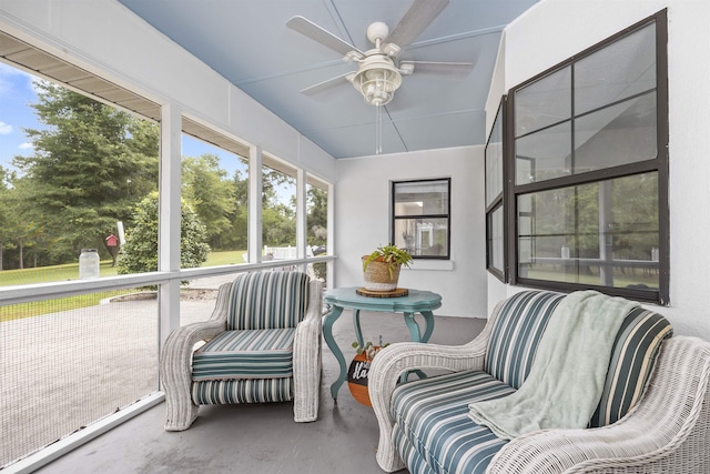 sunroom featuring ceiling fan