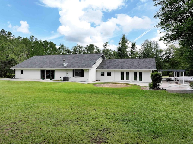 back of property featuring a lawn, french doors, a patio, and central AC unit