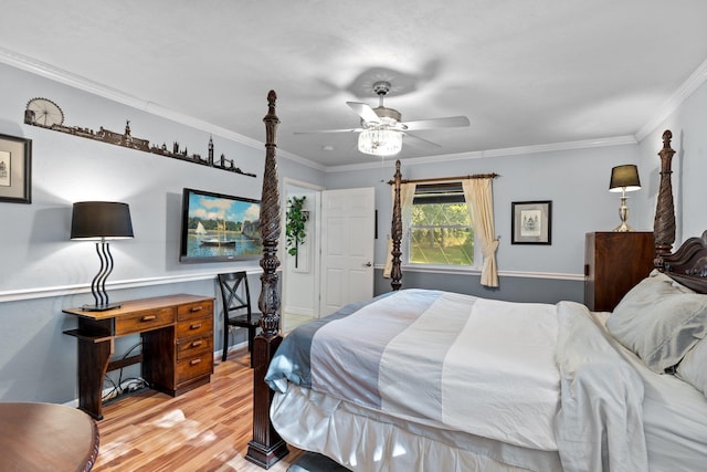 bedroom featuring crown molding, light hardwood / wood-style flooring, and ceiling fan