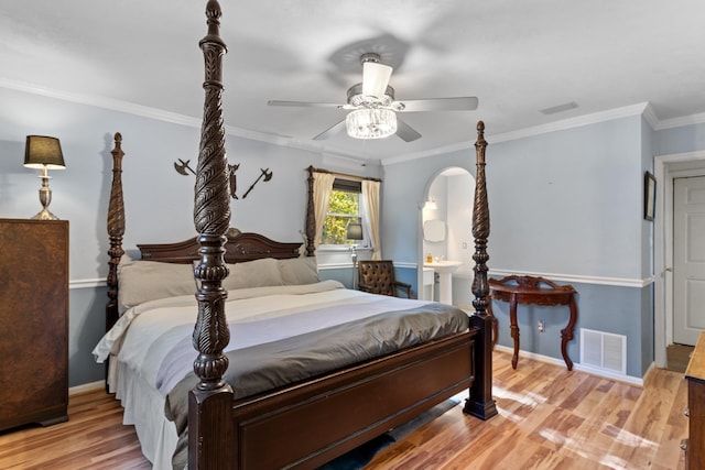 bedroom with crown molding, ceiling fan, and light wood-type flooring