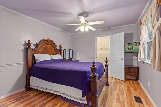 bedroom featuring crown molding, ceiling fan, and light wood-type flooring