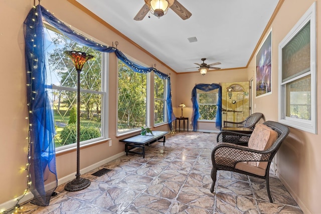 sunroom with ceiling fan