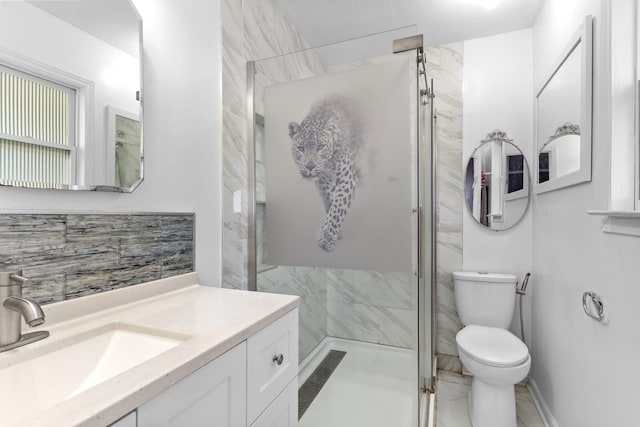 bathroom with vanity, toilet, and an enclosed shower