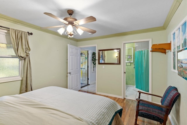 bedroom with crown molding, ceiling fan, ensuite bath, and light hardwood / wood-style flooring