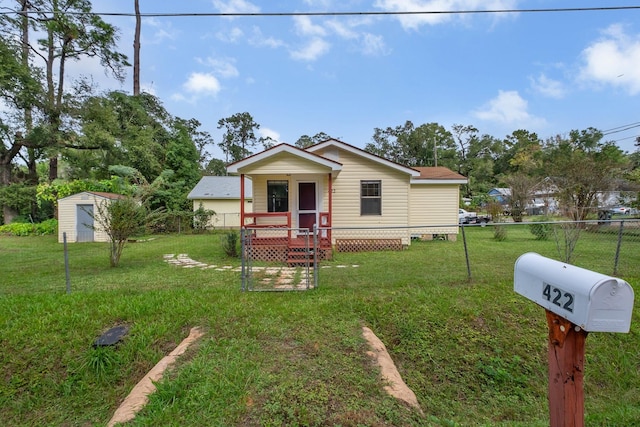 view of front of home with a porch and a front yard