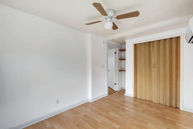 unfurnished bedroom featuring ceiling fan, a closet, and hardwood / wood-style flooring