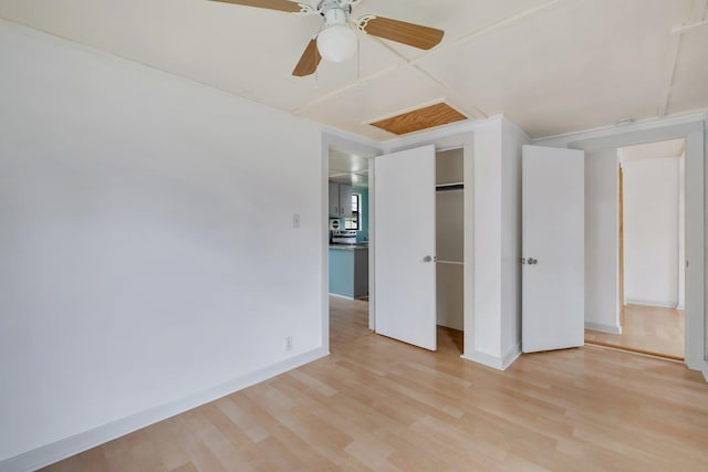 unfurnished bedroom with a closet, ceiling fan, and light hardwood / wood-style flooring