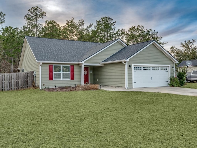 single story home featuring a garage and a front yard