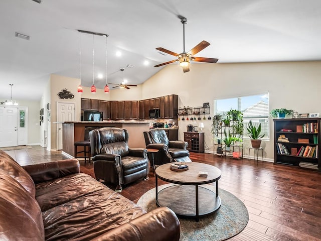 living room featuring high vaulted ceiling, dark hardwood / wood-style floors, and ceiling fan