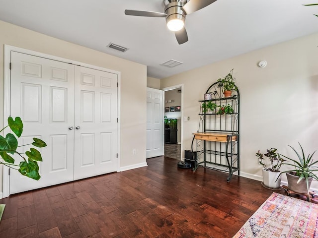 interior space featuring dark wood-type flooring and a closet