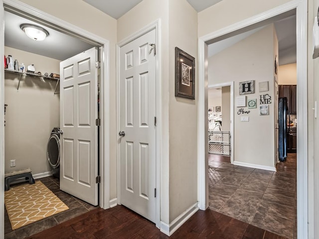 corridor featuring dark hardwood / wood-style flooring and washer / clothes dryer