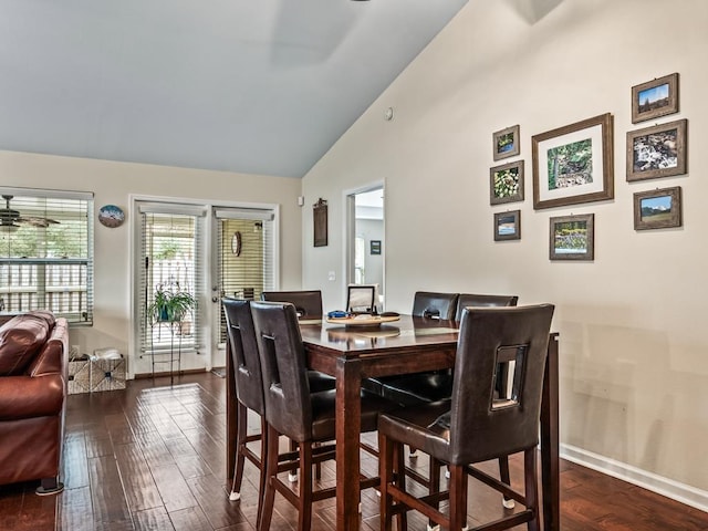 dining room featuring dark hardwood / wood-style flooring and high vaulted ceiling