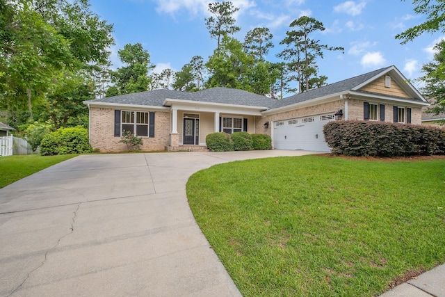3574 Strolling Way, Tallahassee, FL 32311 - view of front of house with brick siding, a front yard, driveway, an attached garage, and roof with shingles