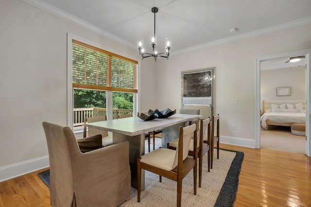 3574 Strolling Way, Tallahassee, FL 32311 - dining room featuring a chandelier, crown molding, and light wood-style flooring