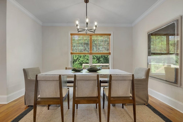 3574 Strolling Way, Tallahassee, FL 32311 - dining room featuring a chandelier, crown molding, and light wood finished floors
