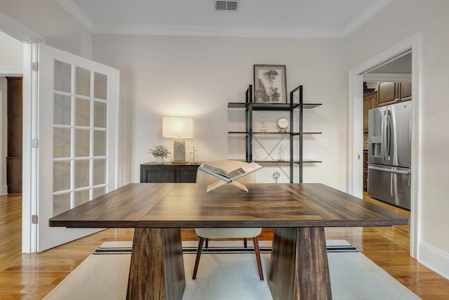3574 Strolling Way, Tallahassee, FL 32311 - dining area featuring light wood-type flooring and ornamental molding