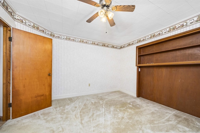 511 SW Sundown Creek Rd, Madison, FL 32340 - unfurnished room with carpet, wallpapered walls, a ceiling fan, and baseboards