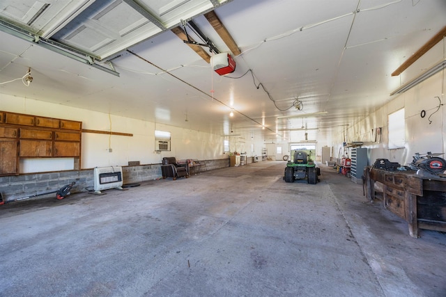 511 SW Sundown Creek Rd, Madison, FL 32340 - garage featuring heating unit and a garage door opener