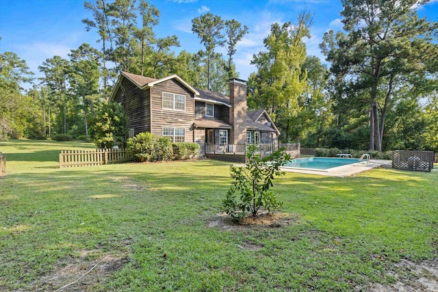 view of yard featuring a swimming pool side deck