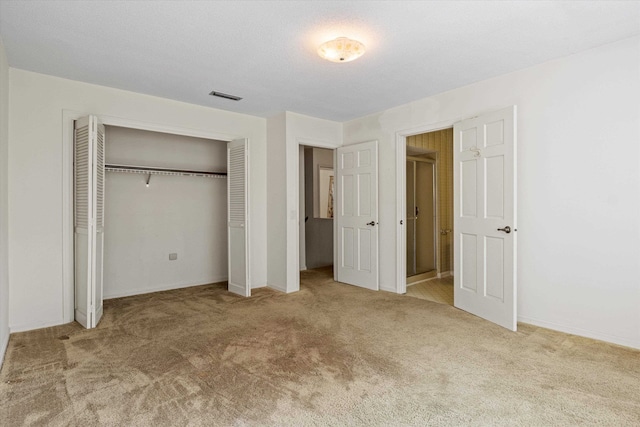 unfurnished bedroom with light colored carpet