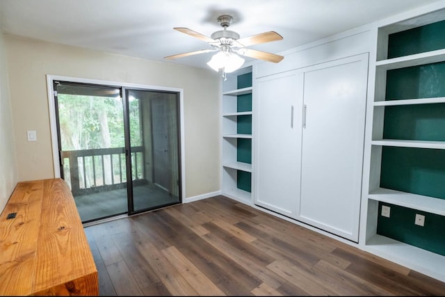 unfurnished bedroom with ceiling fan, dark hardwood / wood-style flooring, and access to outside