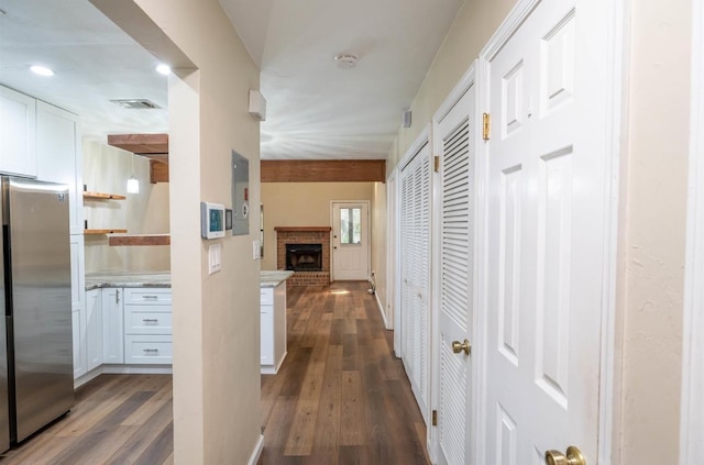 hallway featuring dark hardwood / wood-style floors