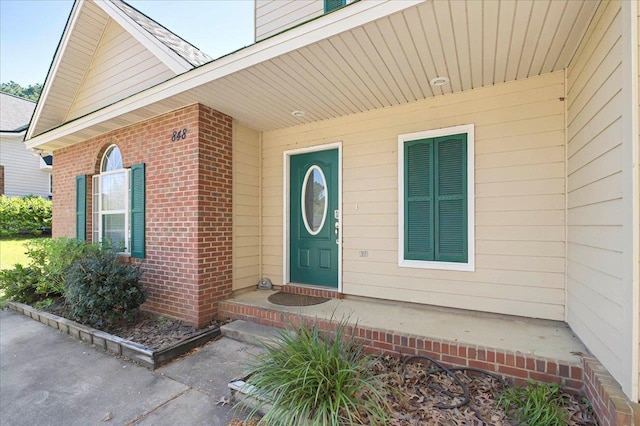 entrance to property with brick siding