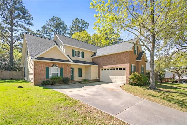 traditional-style house featuring concrete driveway, fence, a front lawn, brick siding, and a shingled roof