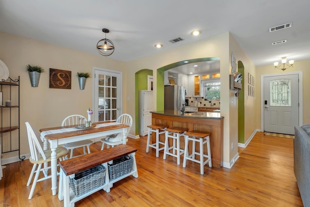 dining room with light hardwood / wood-style floors