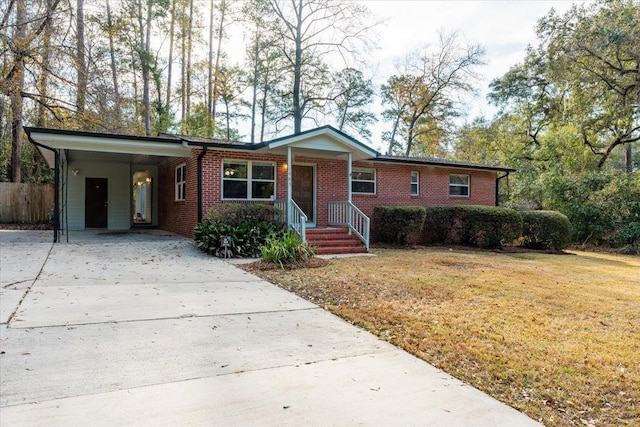 single story home featuring a carport and a front yard