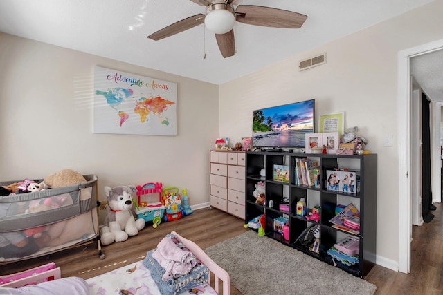 bedroom featuring dark wood-type flooring and ceiling fan