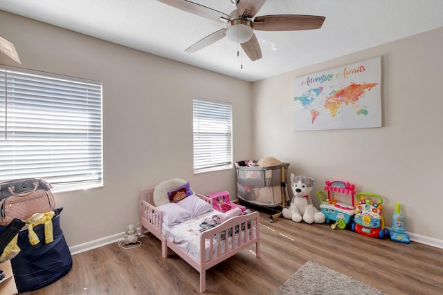 bedroom with hardwood / wood-style flooring and ceiling fan