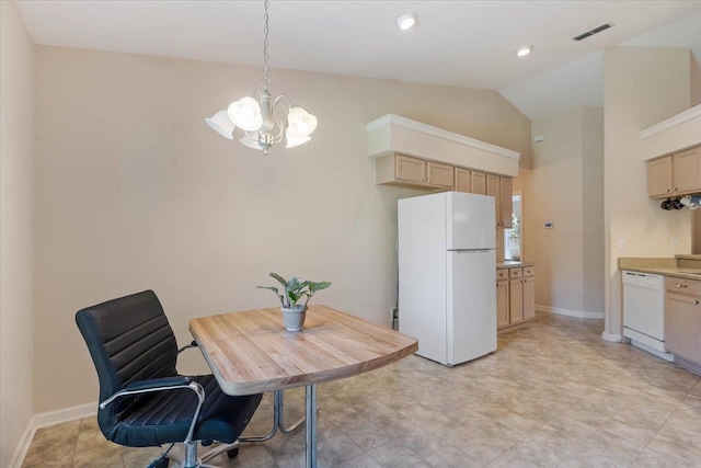 dining room with vaulted ceiling and a notable chandelier