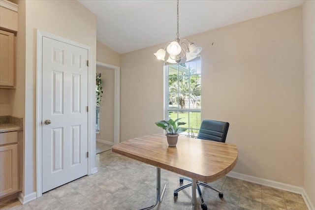 home office featuring a notable chandelier and lofted ceiling